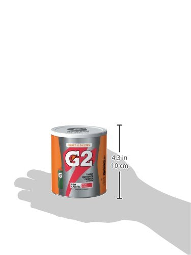 Three canisters neatly stacked on a gym shelf.