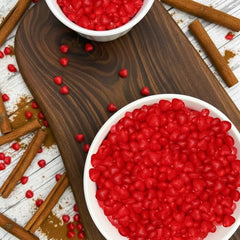 GEEOOLLAH Cinnamon Imperial Hearts in a candy jar display.