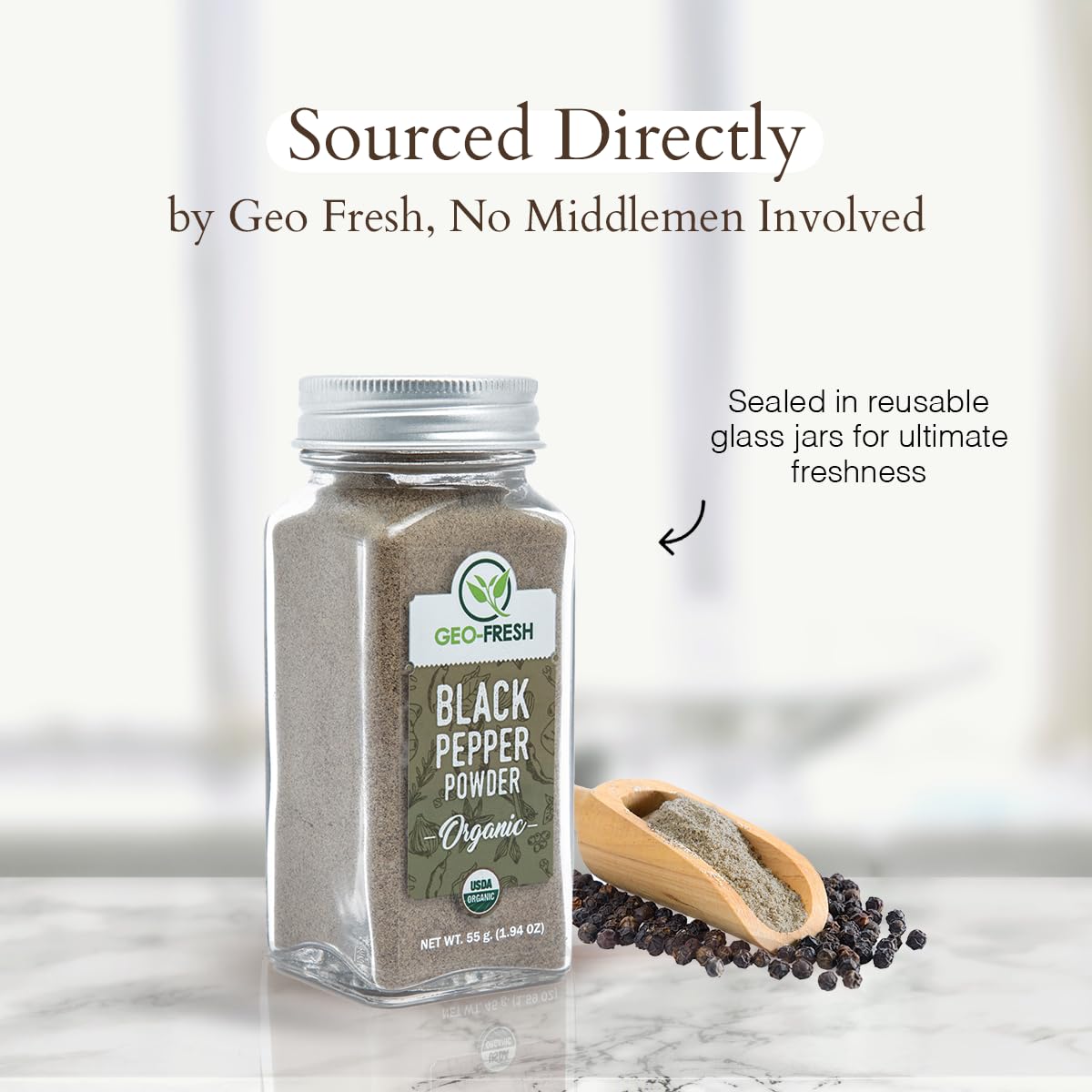 Pouring Geo-Fresh Organic Black Pepper Powder from jar for seasoning.