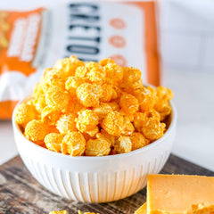 G.H. Cretors Cheddar Cheese Popcorn closeup with rich aroma.