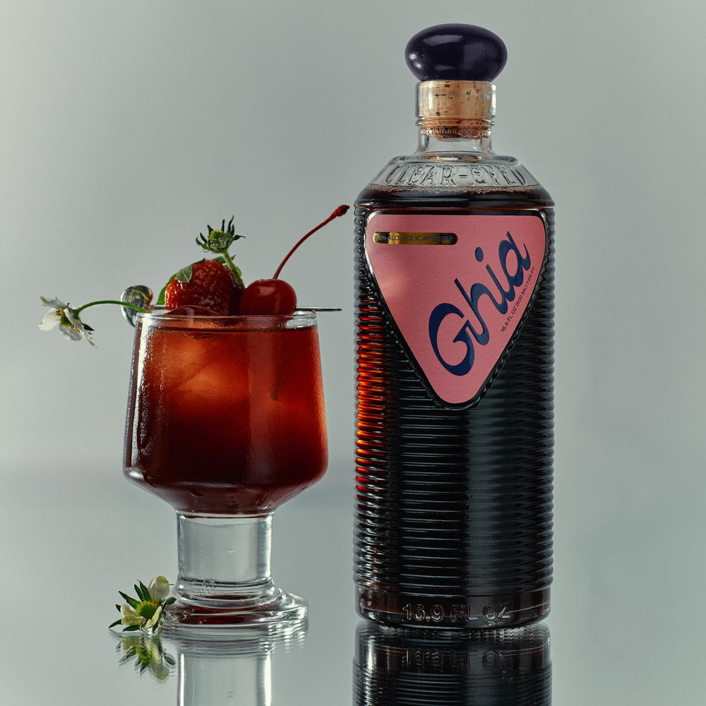Ghia Berry Aperitif bottle with garnish, ready to elevate non-alcoholic gatherings.