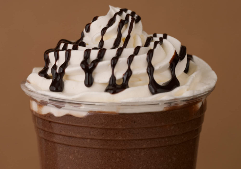 Close-up of Ghirardelli chocolate sauce bottle, highlighting convenient squeeze bottle 16 oz size.