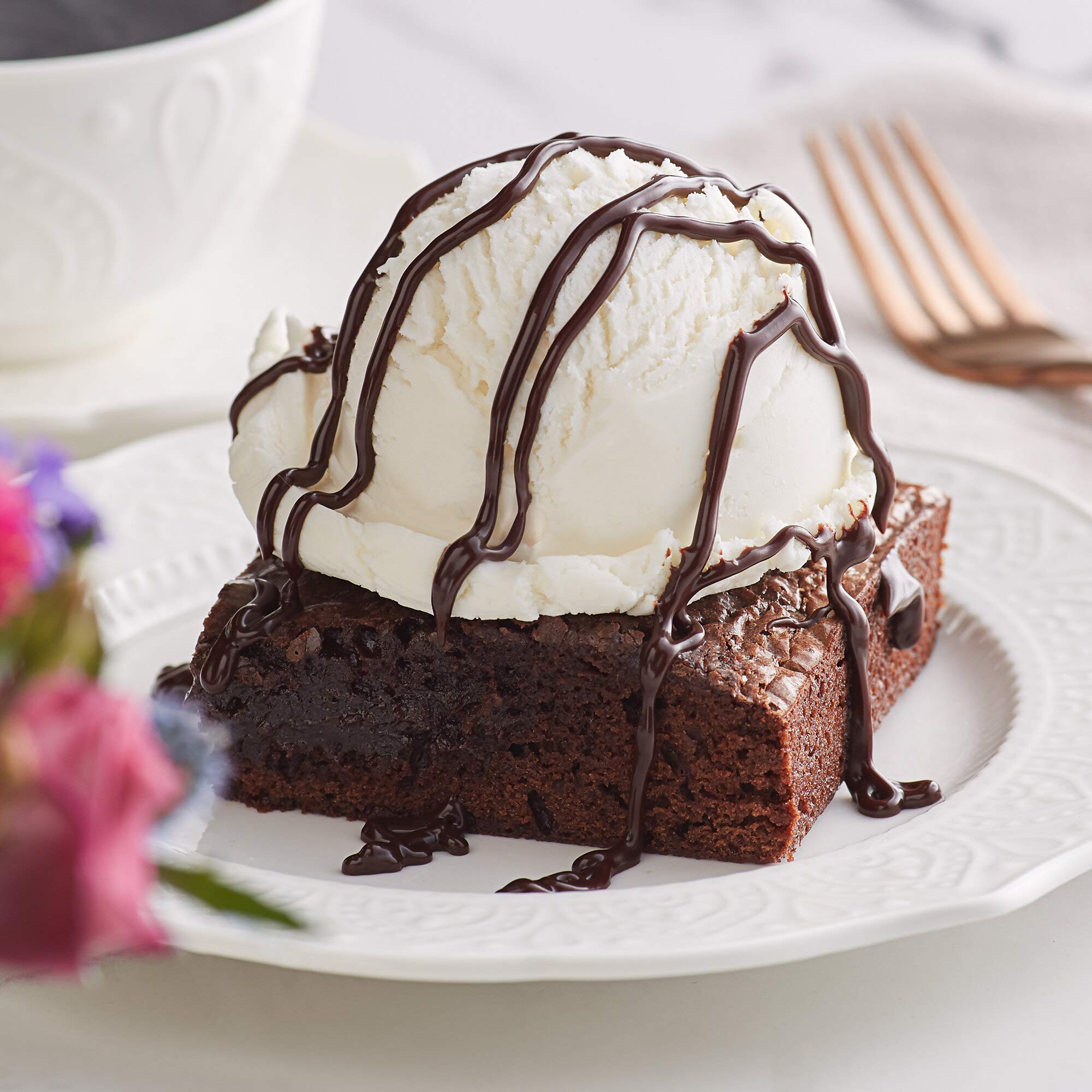Ghirardelli Black Label sauce creates a glossy dessert finish.