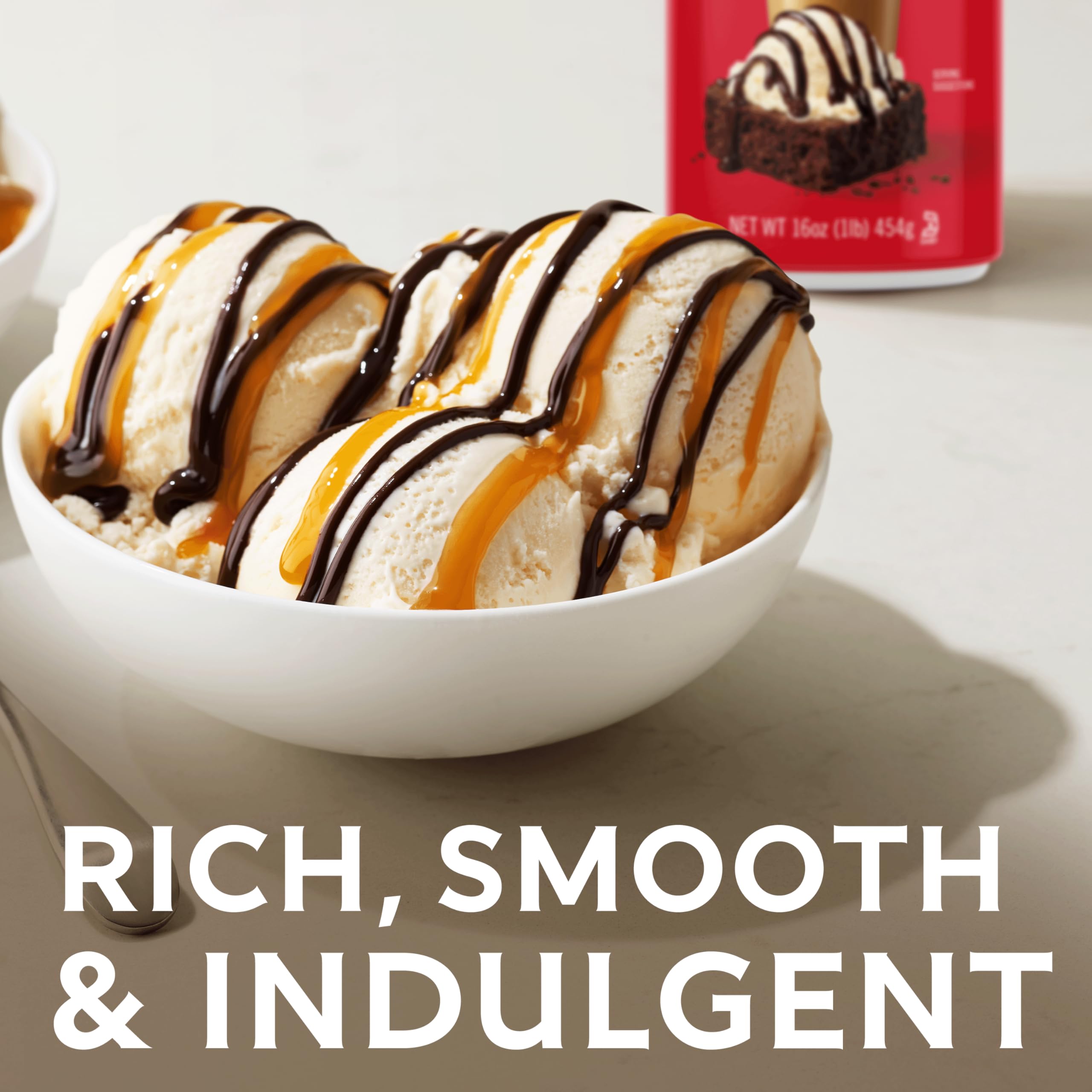 Ghirardelli sauce drizzle over ice cream for indulgent topping.