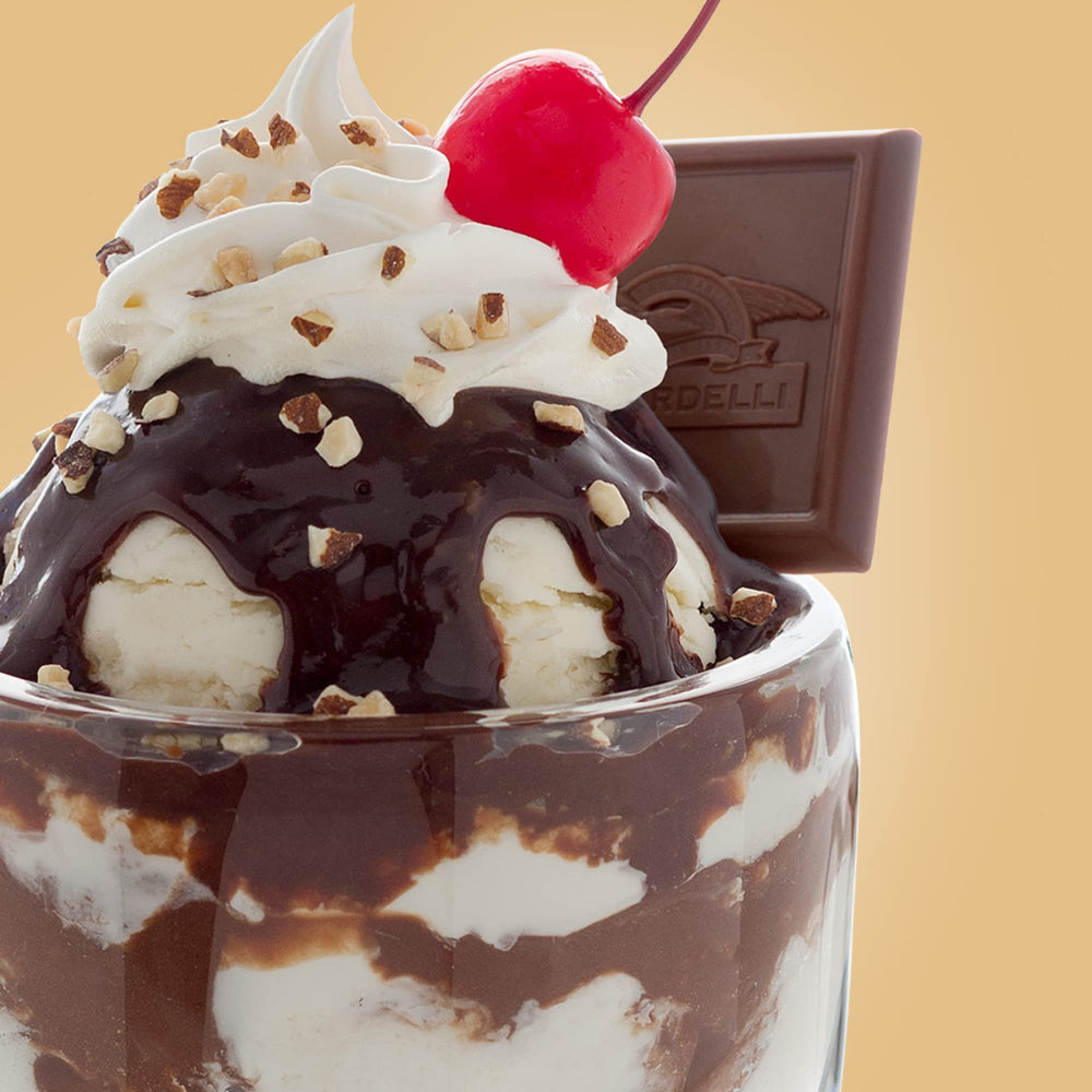 Ghirardelli chocolate sauce on a milkshake, luxurious finish.