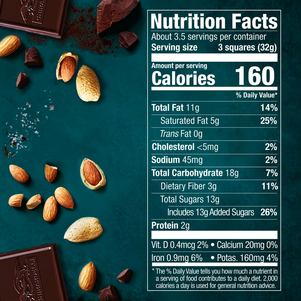 Close-up of chocolate square highlights roasted almonds and sea salt for a bold, balanced bite.