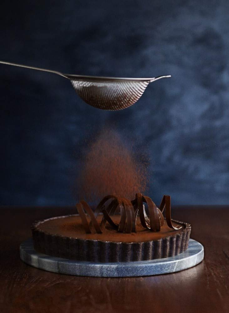 Ghirardelli Majestic Dutch Processed Cocoa Powder in pantry for confections.