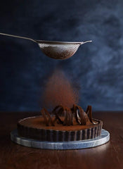 Ghirardelli Majestic Dutch Processed Cocoa Powder in pantry for confections.