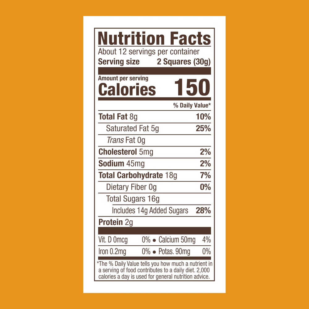 Ghirardelli Milk Chocolate Caramel Squares closeup reveals silky caramel center for a refined treat.