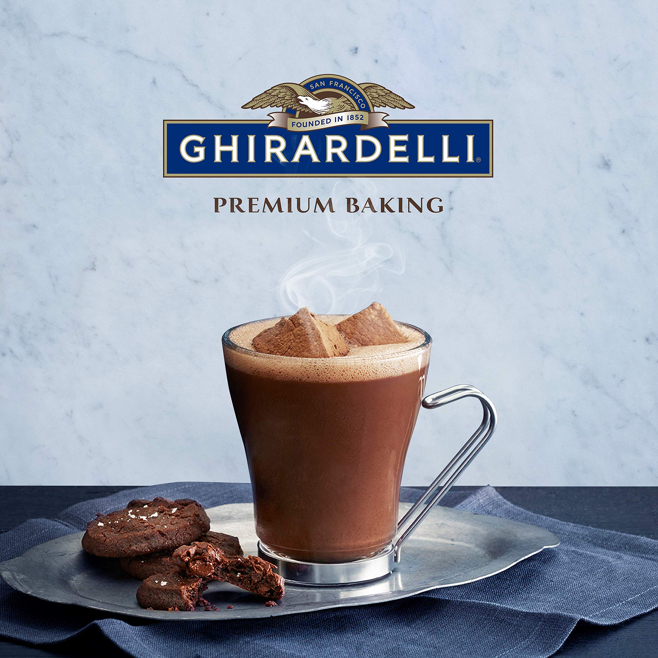 Ghirardelli Mocha Hot Cocoa Mix being whisked into hot milk for rich flavor.