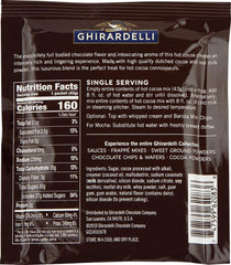 Pouring hot water into a mug with Ghirardelli envelopes for a cozy treat.