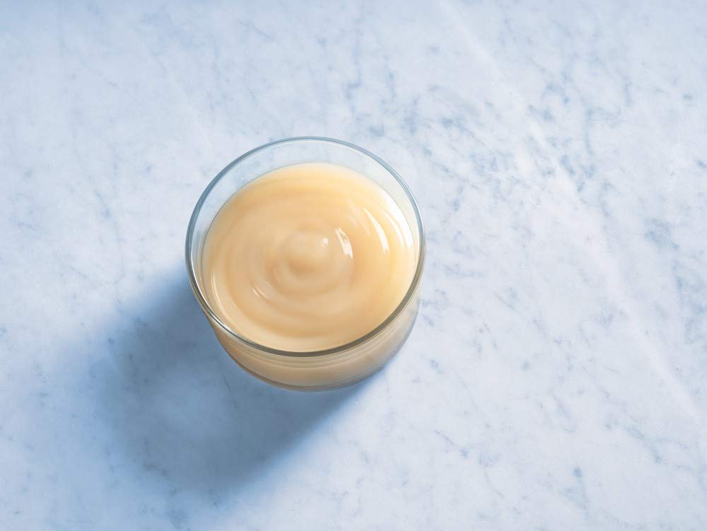 Ghirardelli white chocolate sauce enhances coffee flavor and aroma in espresso