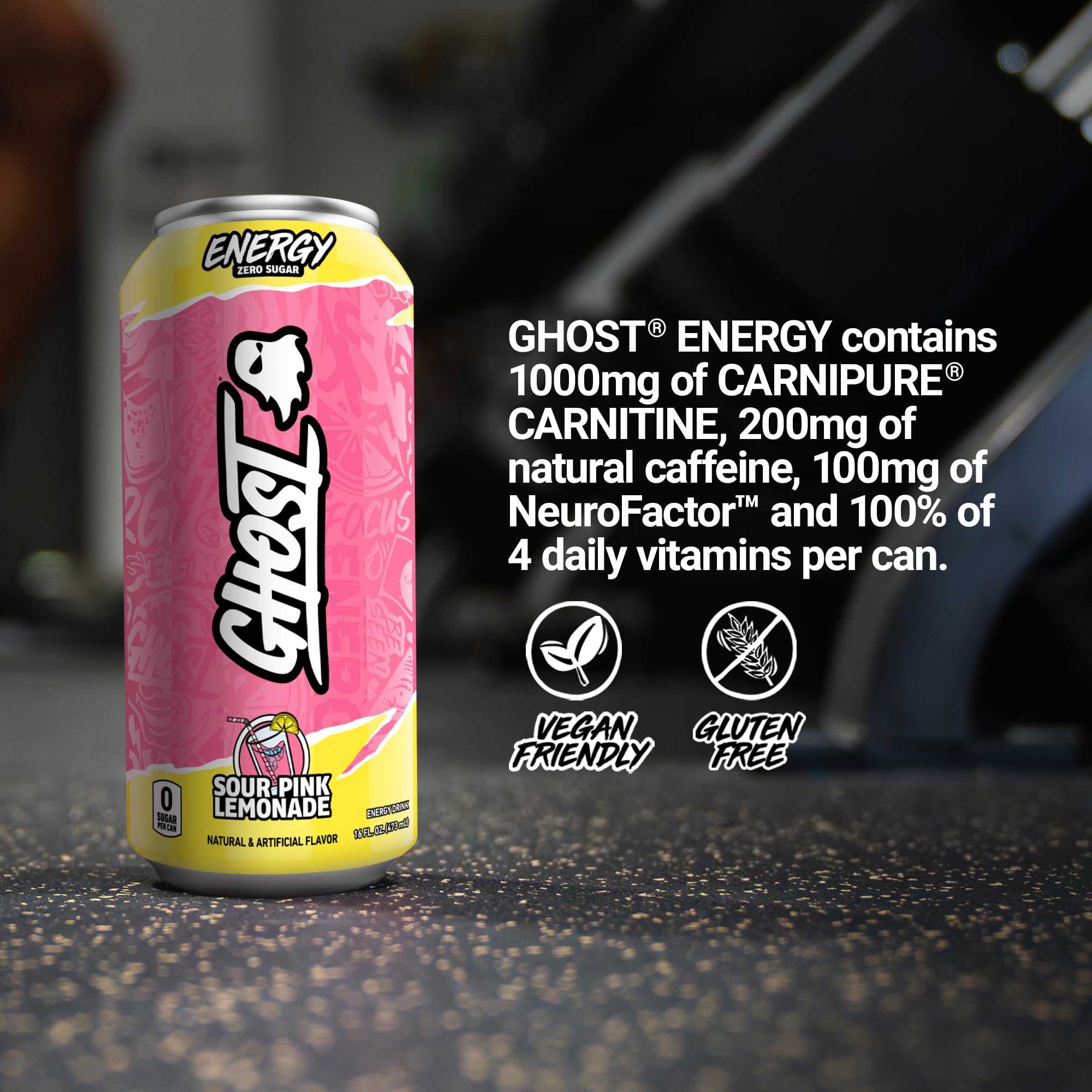 GHOST Energy Sour Pink Lemonade can with gym setting for workout readiness.