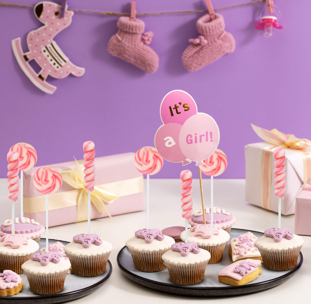 Gift Boutique cake topper lollipops create charming edible accents.