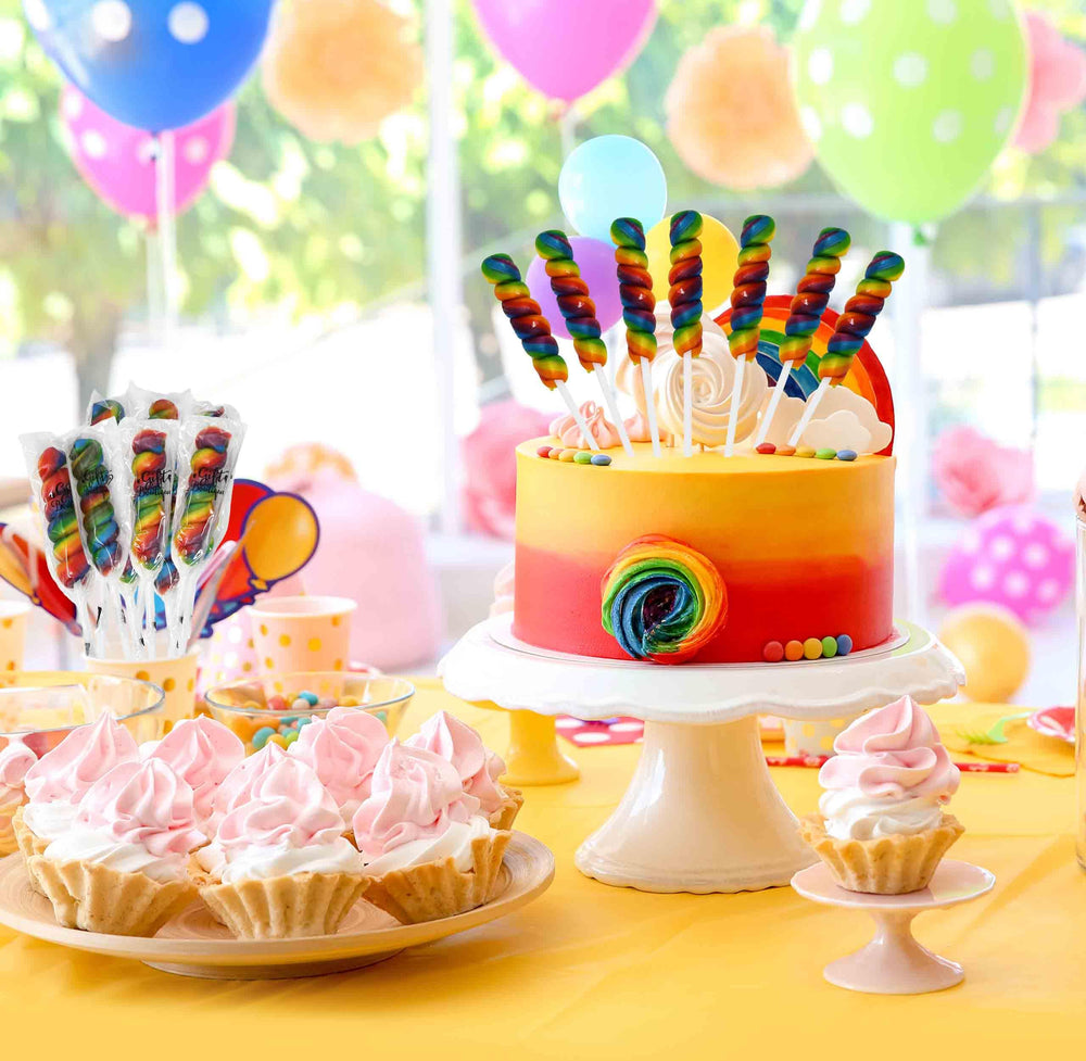 Gift Boutique lollipops used as cake toppers and festive decorations.