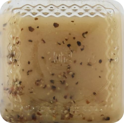 Close-up of Girard's Champagne Dressing label signaling premium flavor.