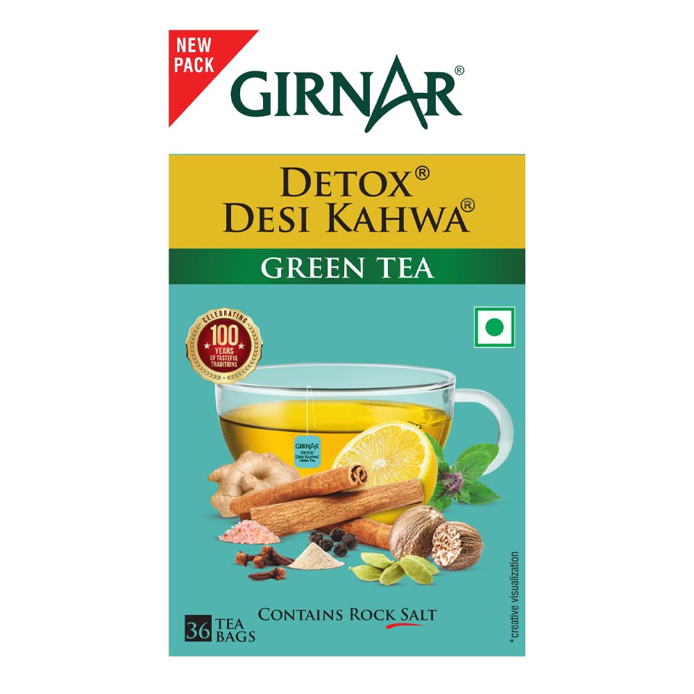 Close-up of herbs and spices in GIRNAR Detox Green Tea blend.