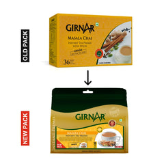 Close-up of Girnar Instant Tea Premix Masala sachets and spices, signaling easy on-the-go preparation.