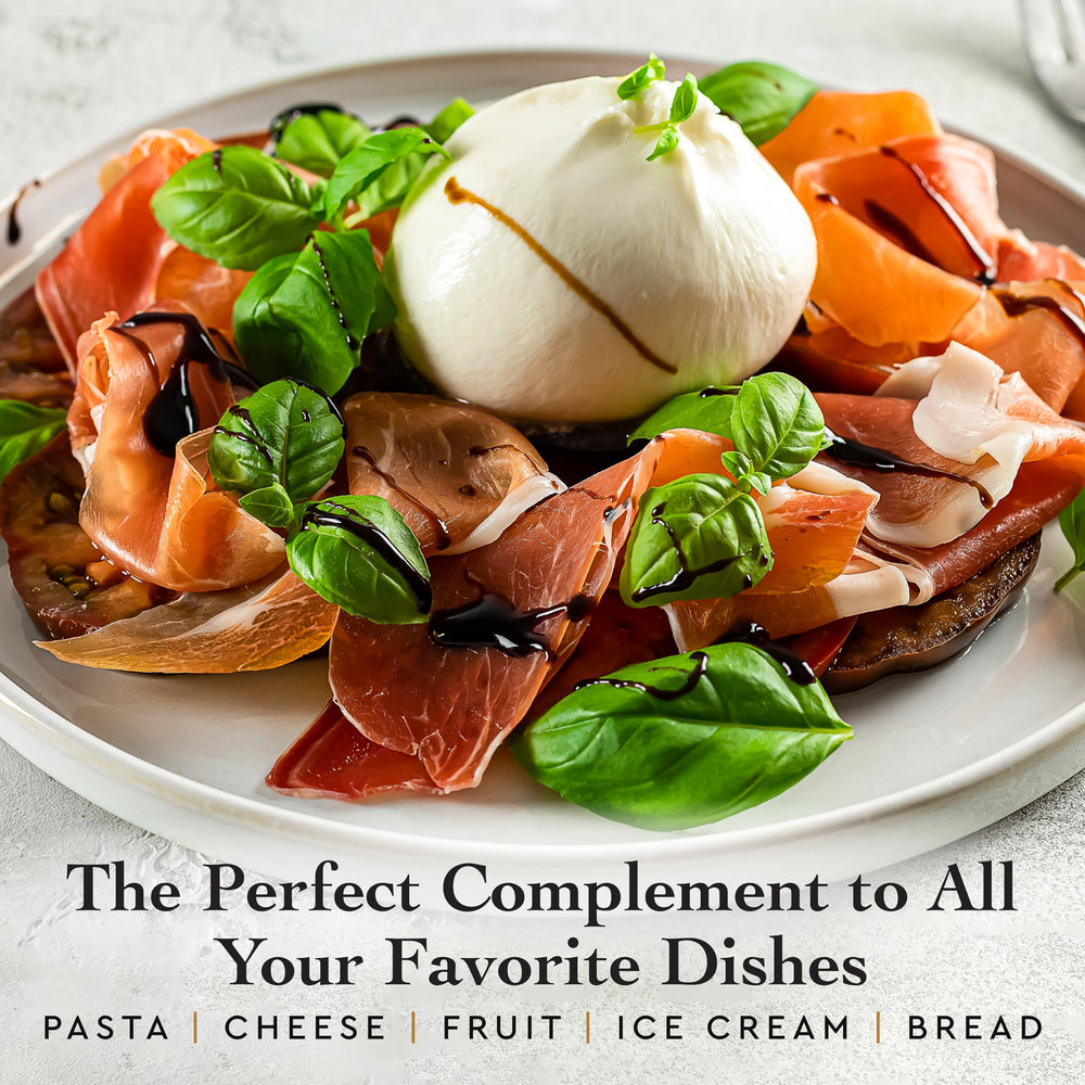 Drizzling Giusti balsamic over cheese and pasta for flavor
