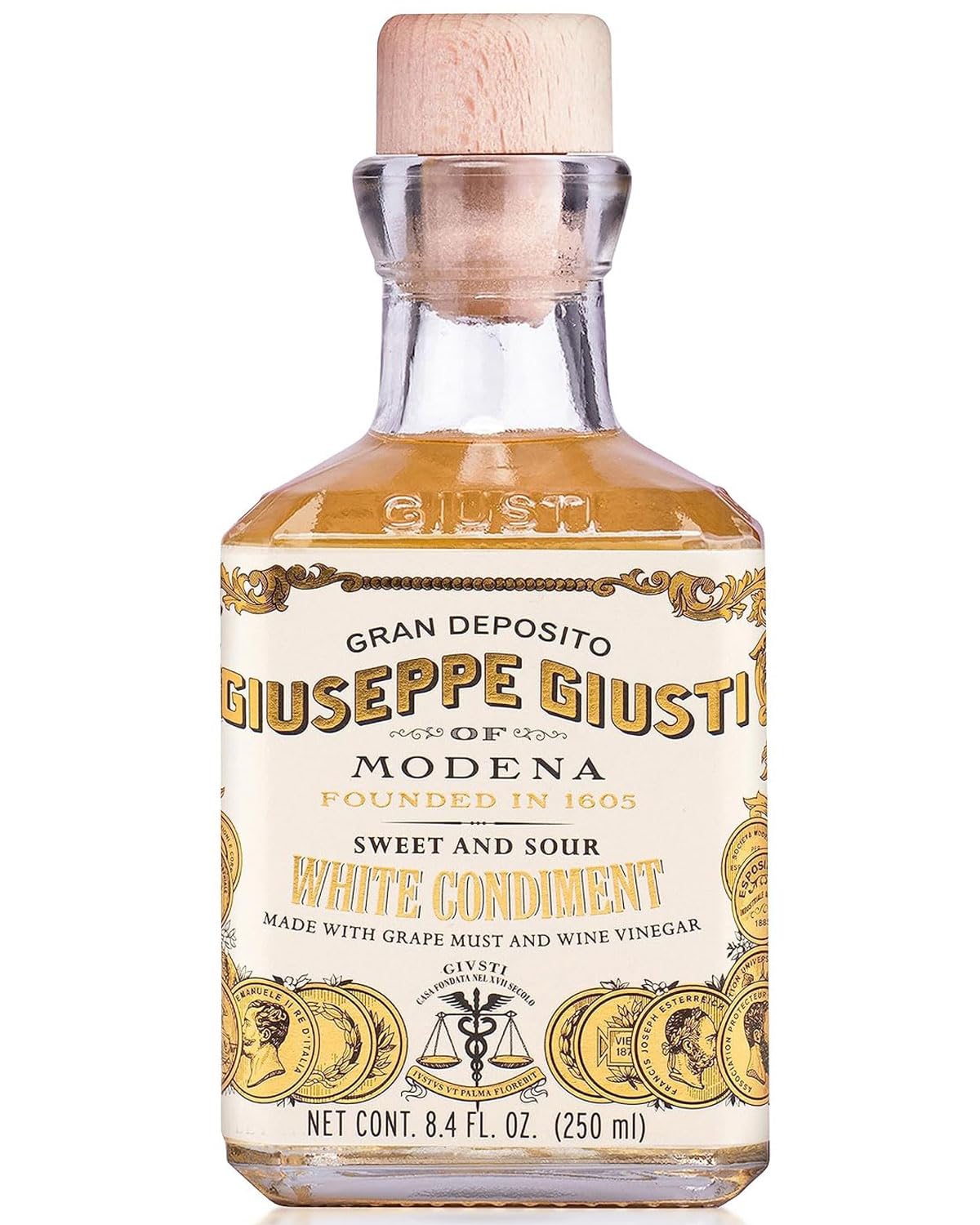Giusti White Balsamic Dressing bottle pouring over salad for bright finish