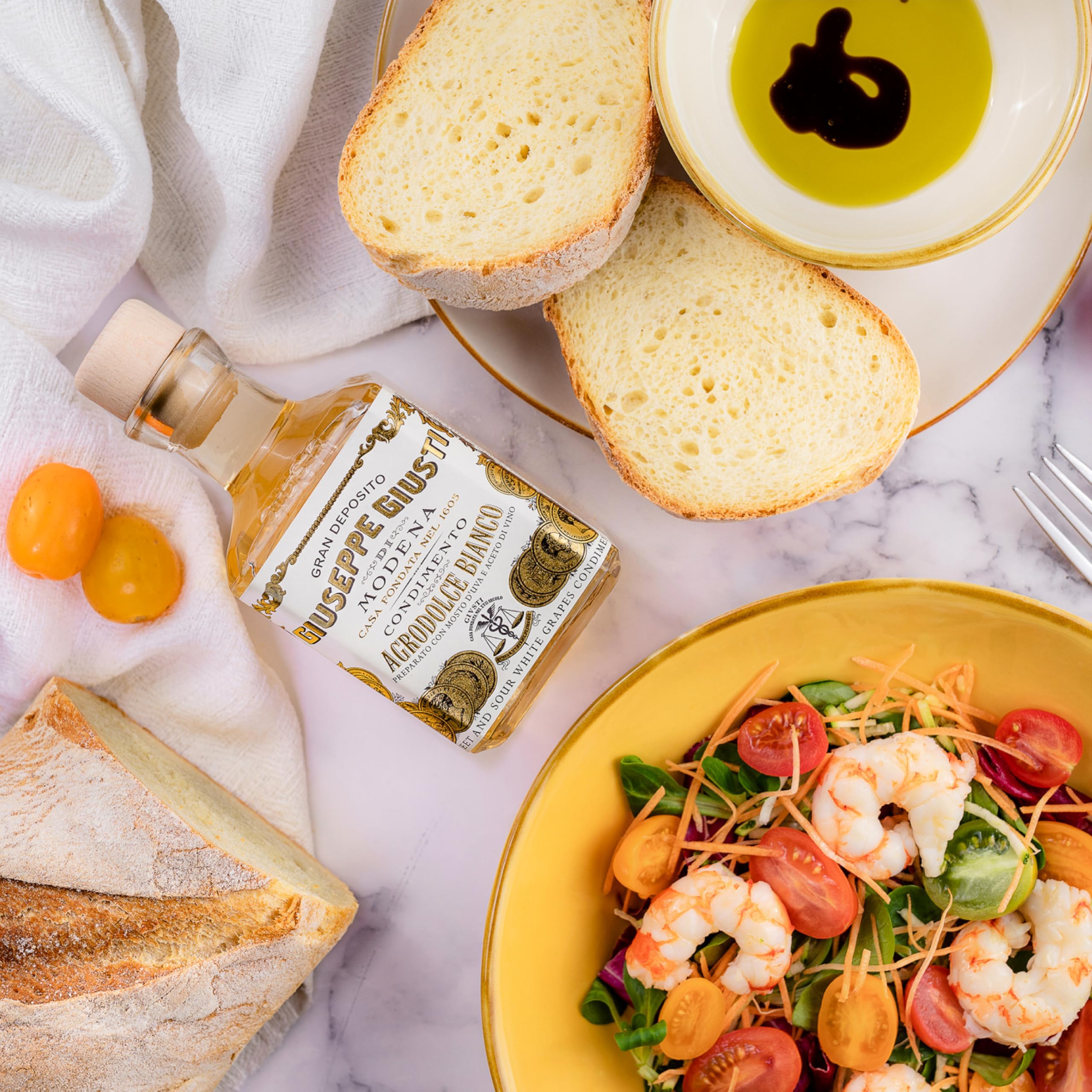 Giusti White Balsamic Dressing over seafood dish for refined flavor