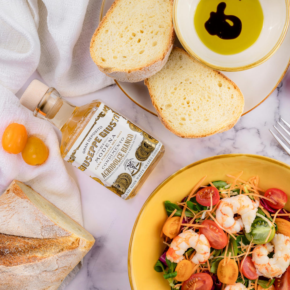 Giusti White Balsamic Dressing over seafood dish for refined flavor
