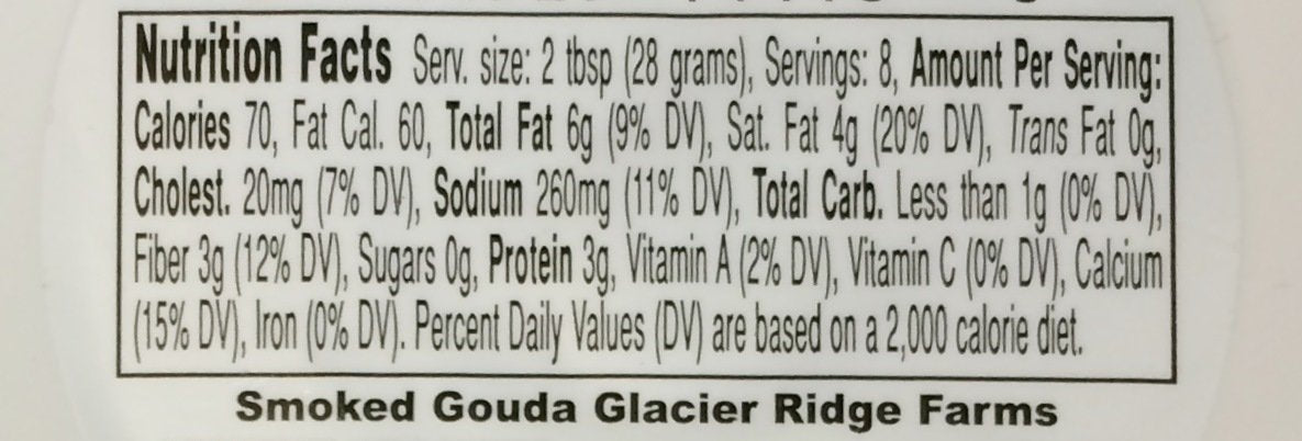 Glacier Ridge Farms Gouda spread on crackers highlights rich smoky flavor.