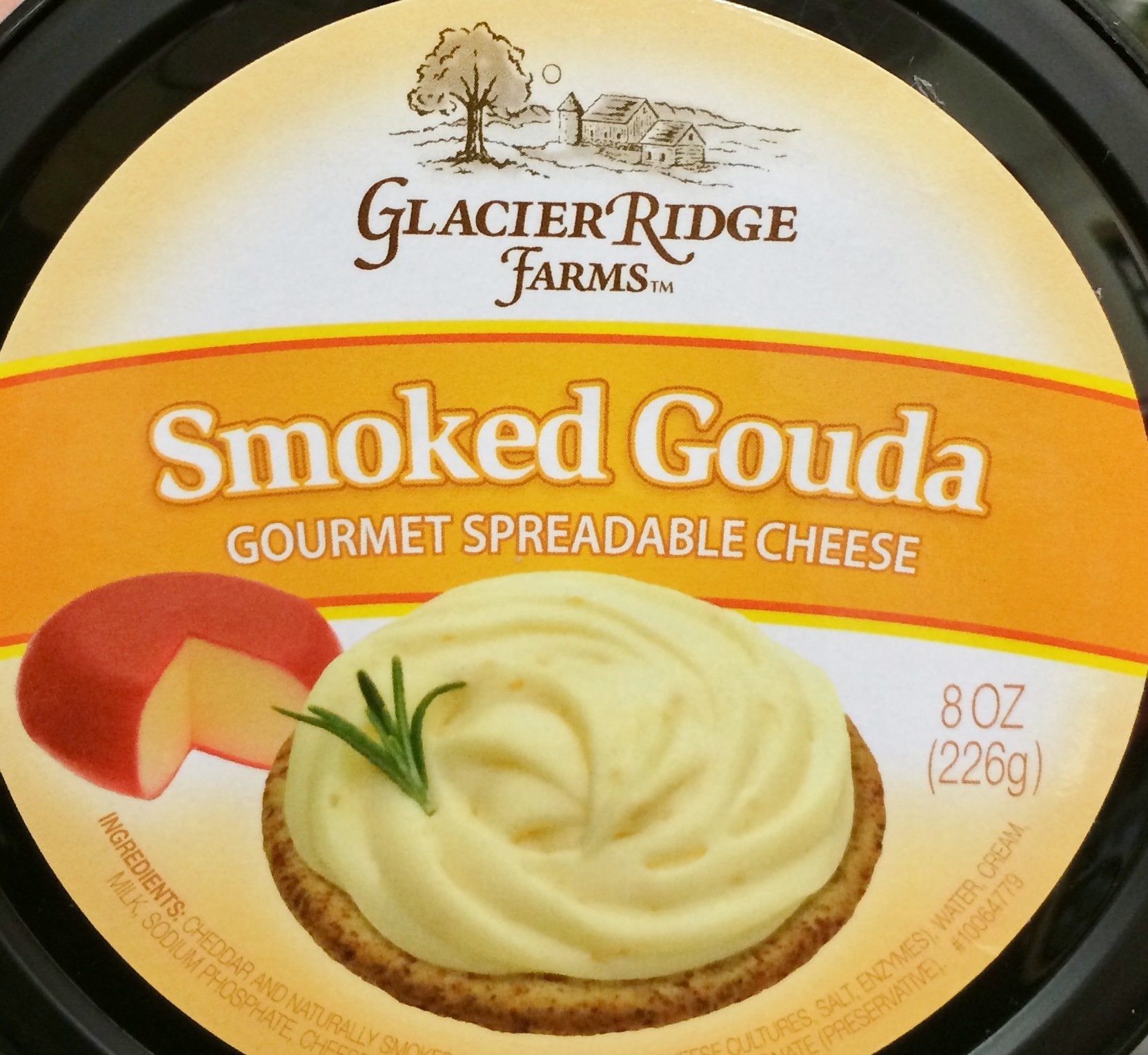 Glacier Ridge Farms smoked Gouda spread in a tub, creamy texture ideal for crackers.