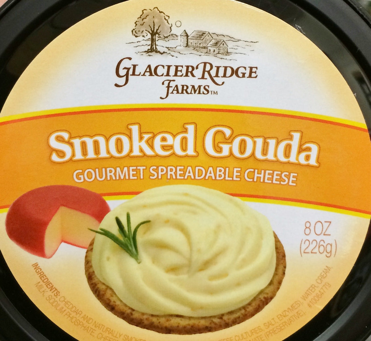 Glacier Ridge Farms smoked Gouda spread in a tub, creamy texture ideal for crackers.
