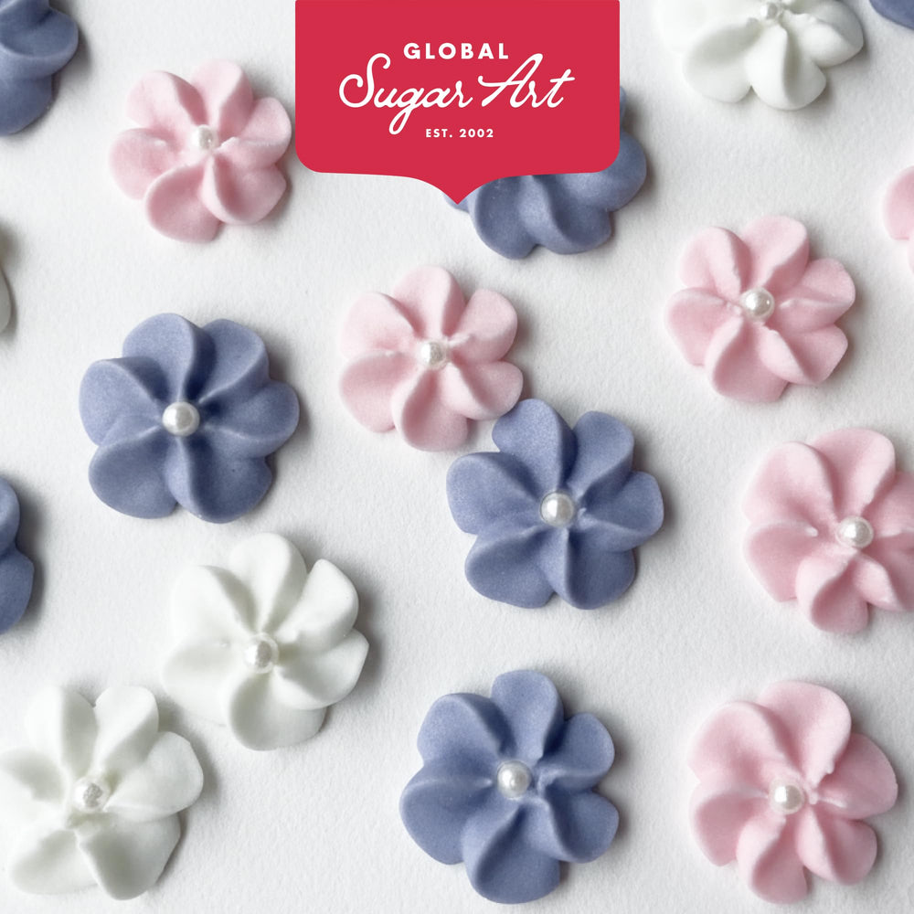 Global Sugar Art edible flowers with pearl centers elevate presentation for cakes and tarts.