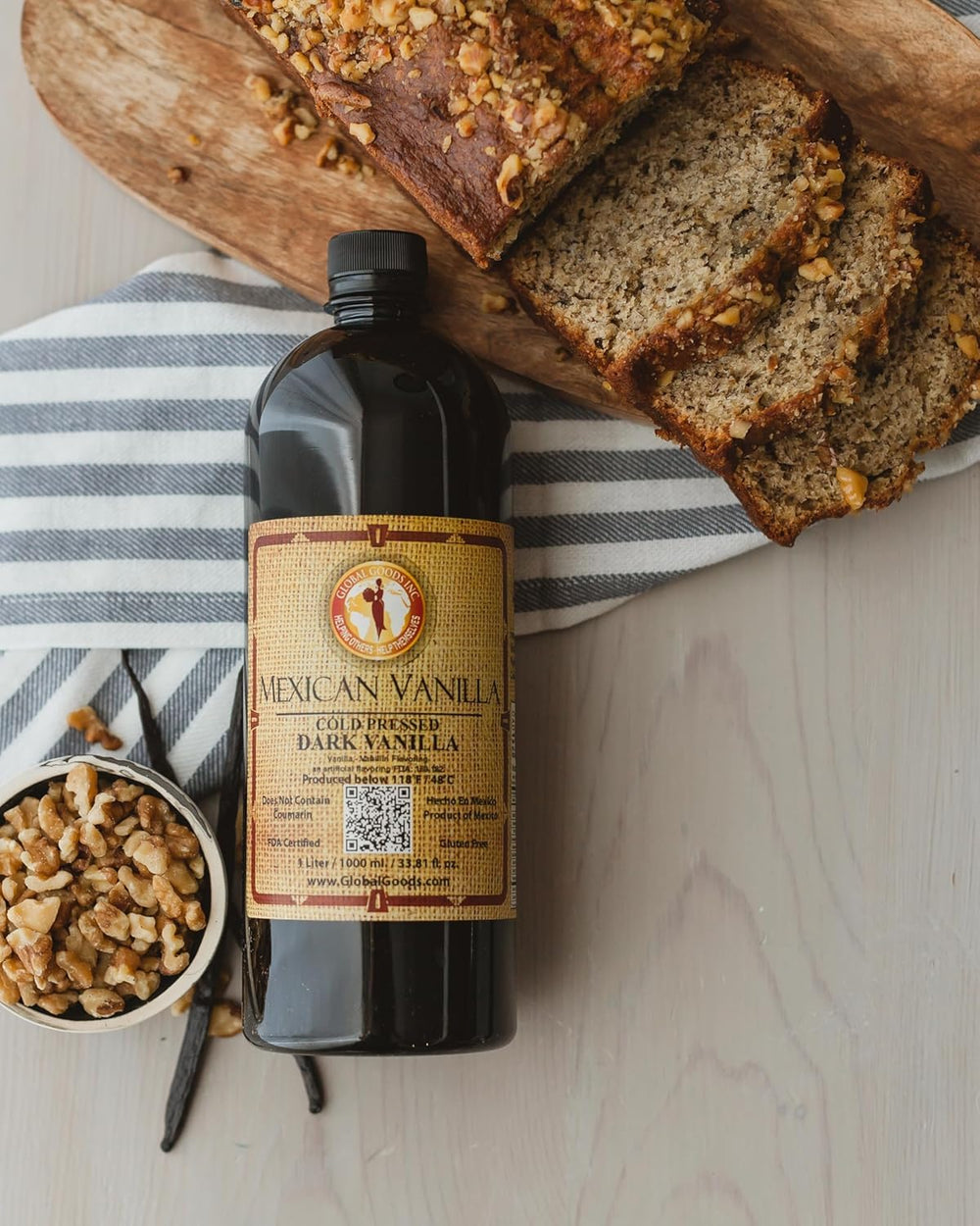 Global Goods pure dark Mexican vanilla pour delivering rich flavor for desserts.
