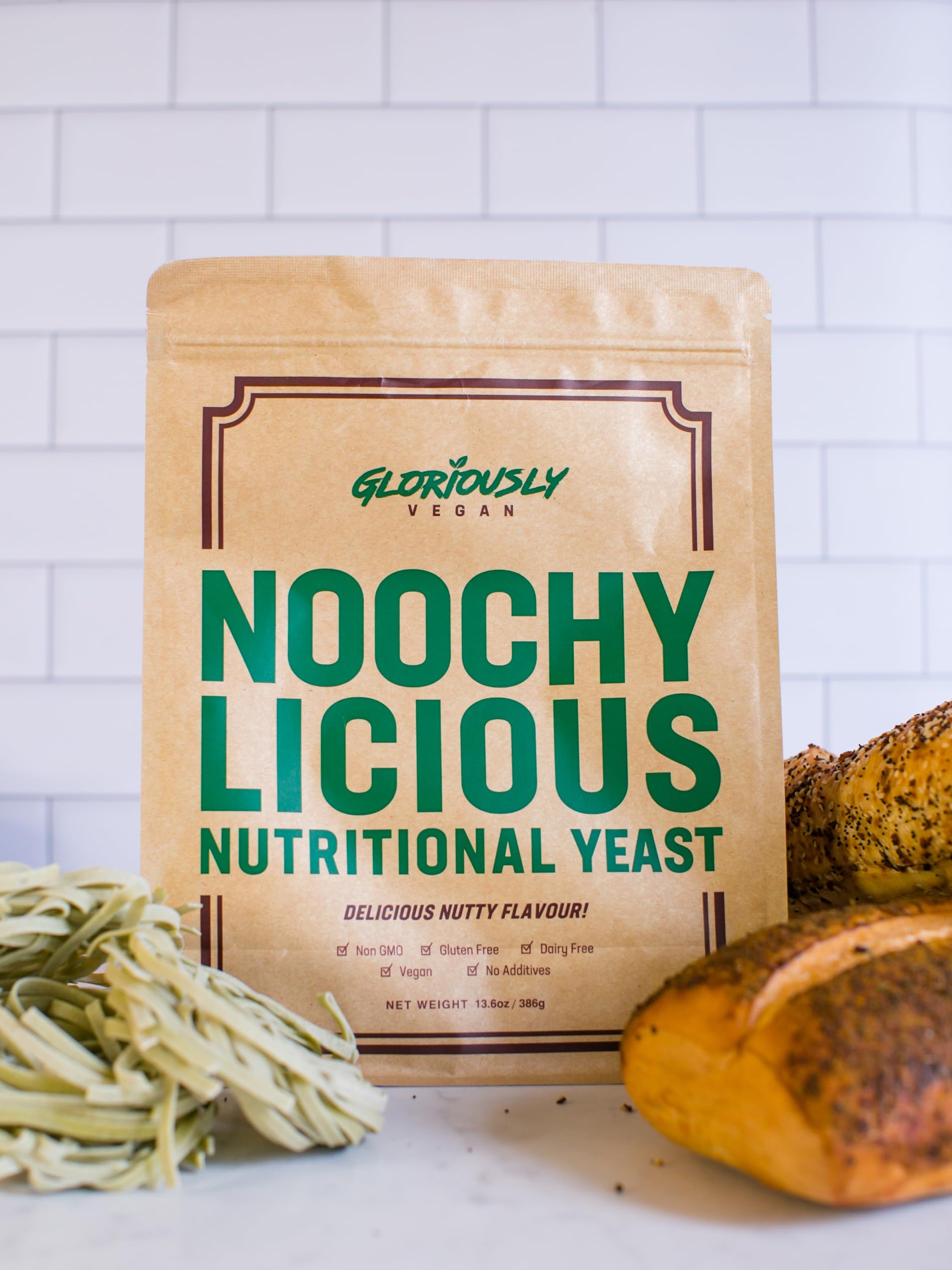 Gloriously Noochy Licious flakes closeup shows gluten free and non GMO ingredients