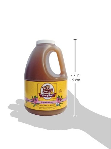 GloryBee honey in a measuring spoon, ideal for precise recipes.