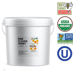 GloryBee organic clover honey bulk pail in kitchen pantry.