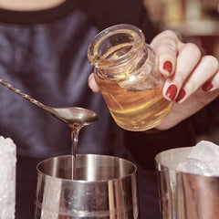 GloryBee label closeup highlights natural ingredients and no artificial flavors.