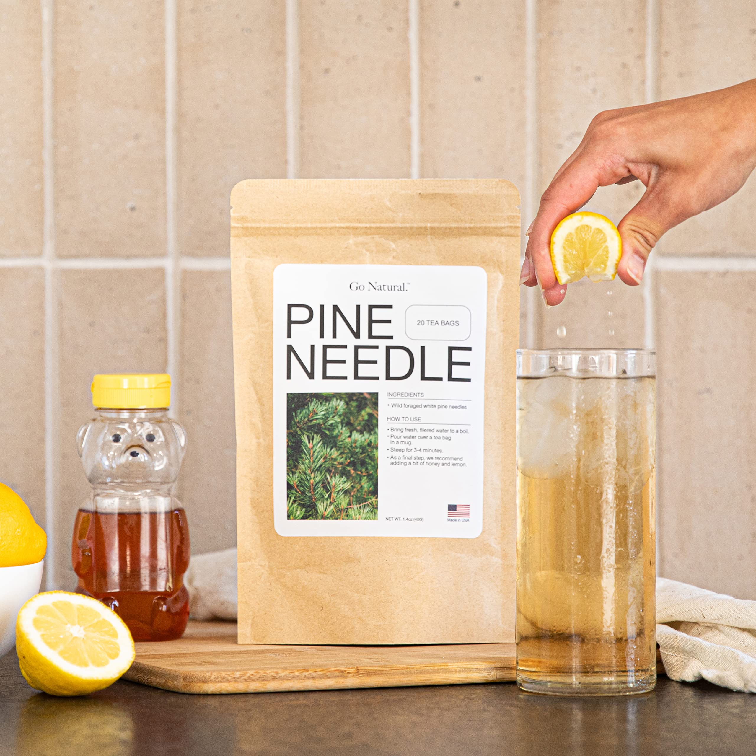 Go Natural pine needle tea in a cup, elevating daily ritual and wellness.