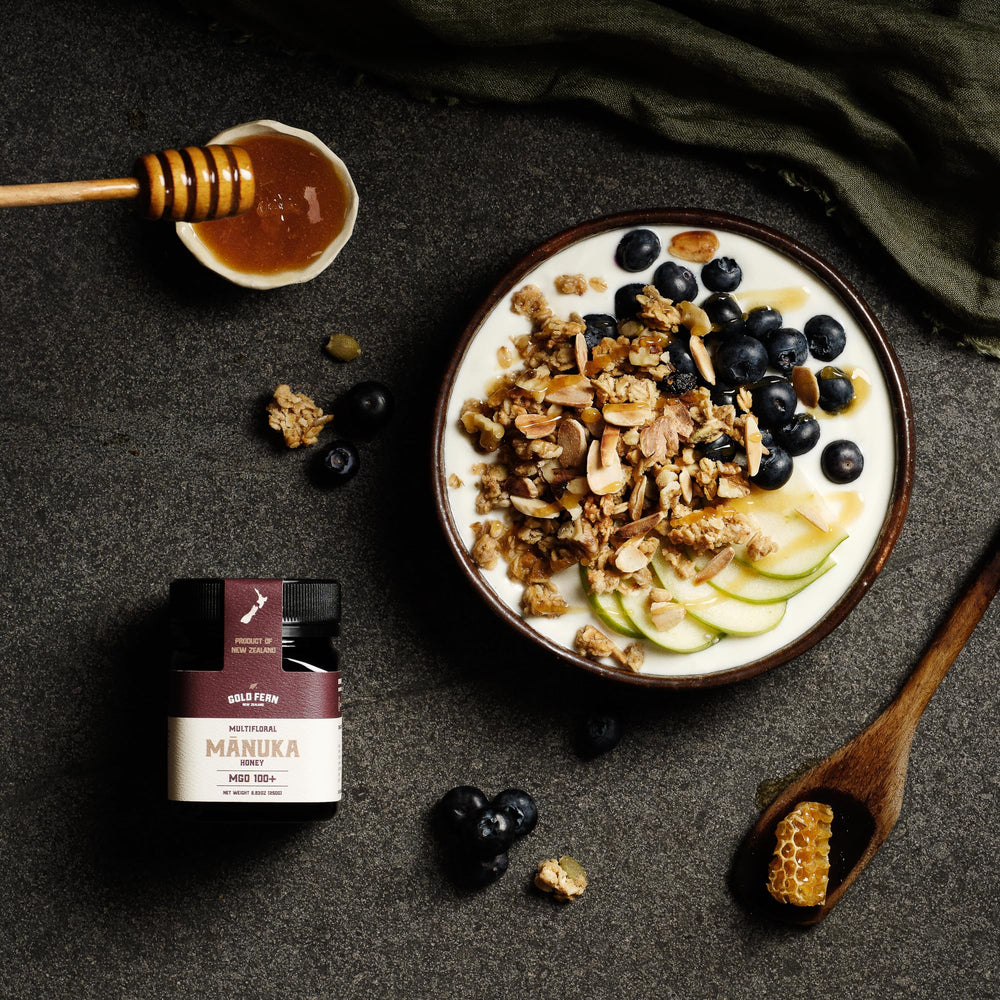 Gold Fern Honey drizzle from spoon shows smooth texture and golden color