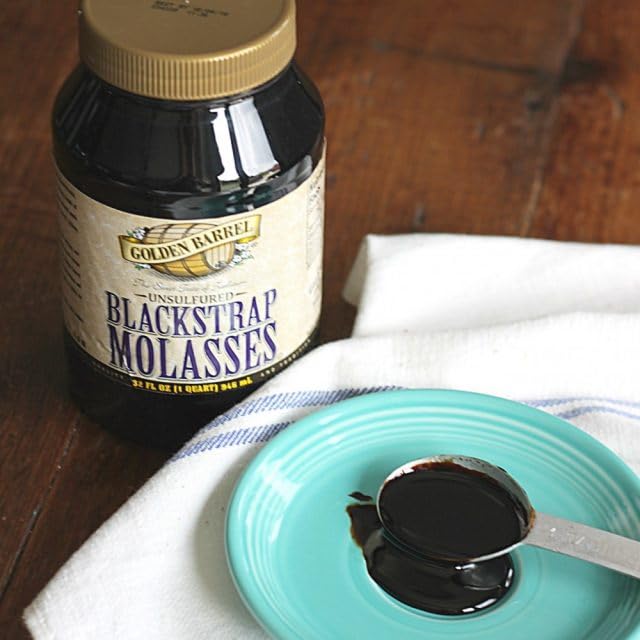 Golden Barrel Black Strap Molasses bottle with strong flavor for hearty baked goods.
