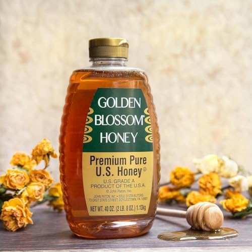 Golden Blossom Honey dipper pouring for drizzle over snacks.