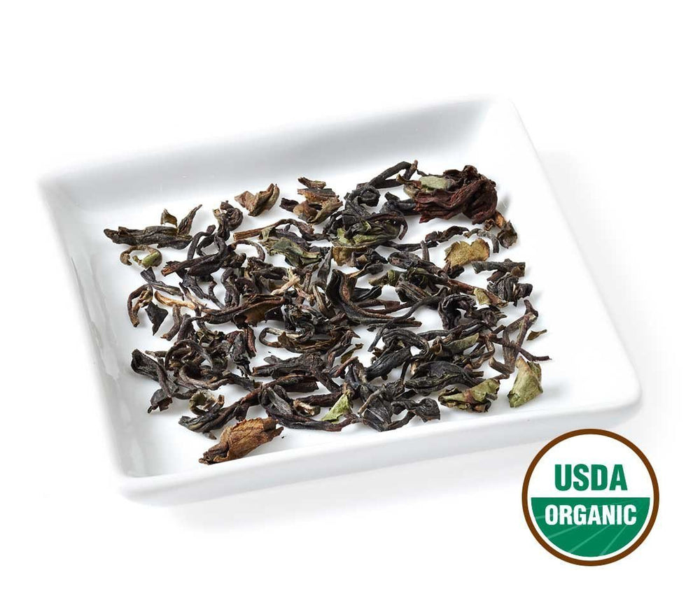 Golden Moon Tea Darjeeling cup during brew session highlighting aroma and color