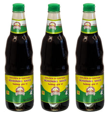 Golden Mountain Seasoning Sauce bottle on the kitchen counter boosts stir-fry flavor.