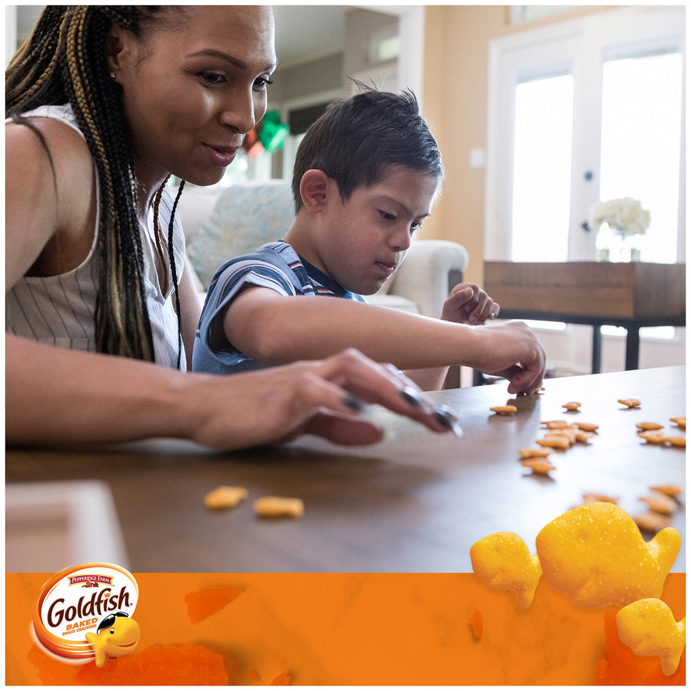 Goldfish Cheddar crackers shared during family gathering evokes smiles and bites.