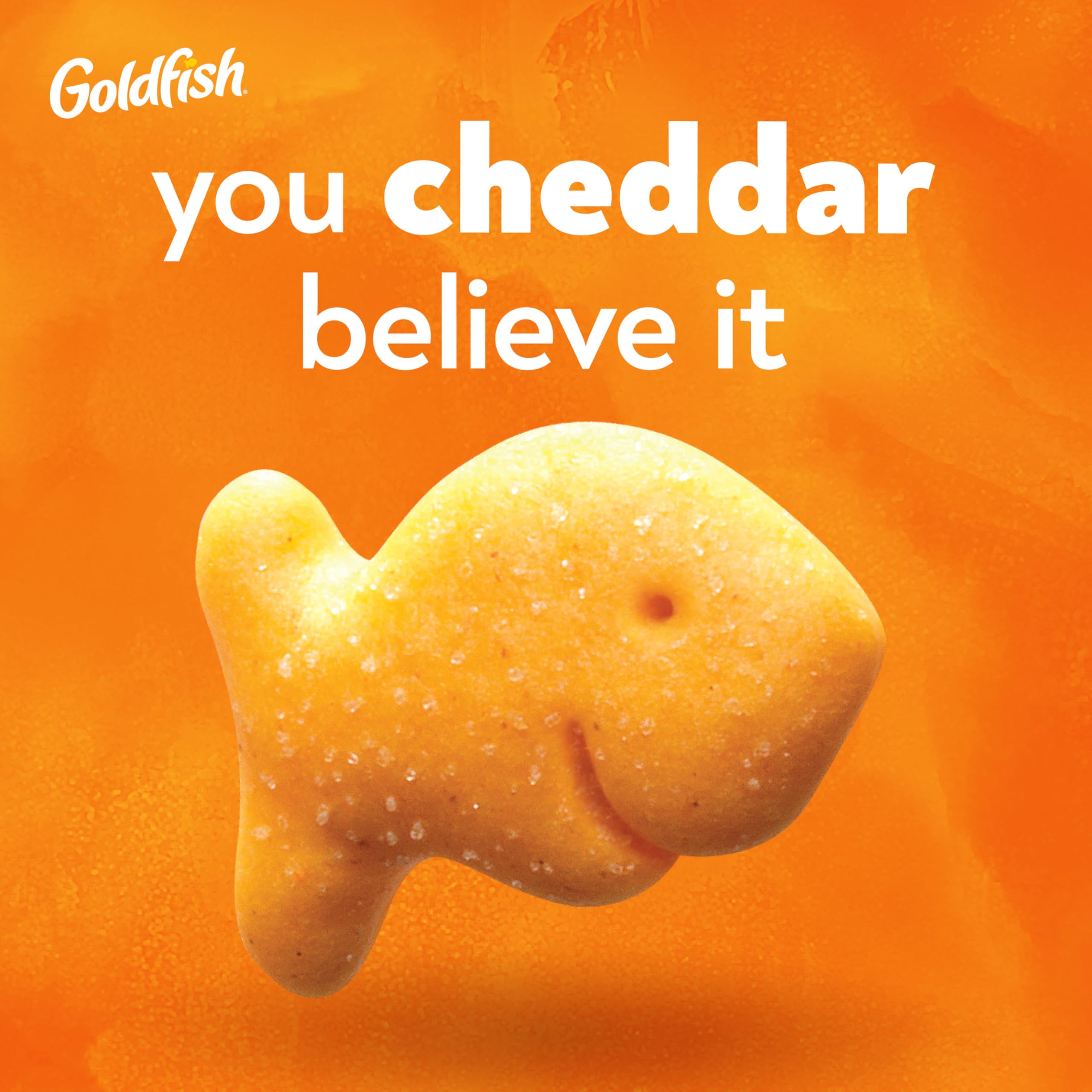 Goldfish Cheddar Crackers on table with family, convenient for sharing.