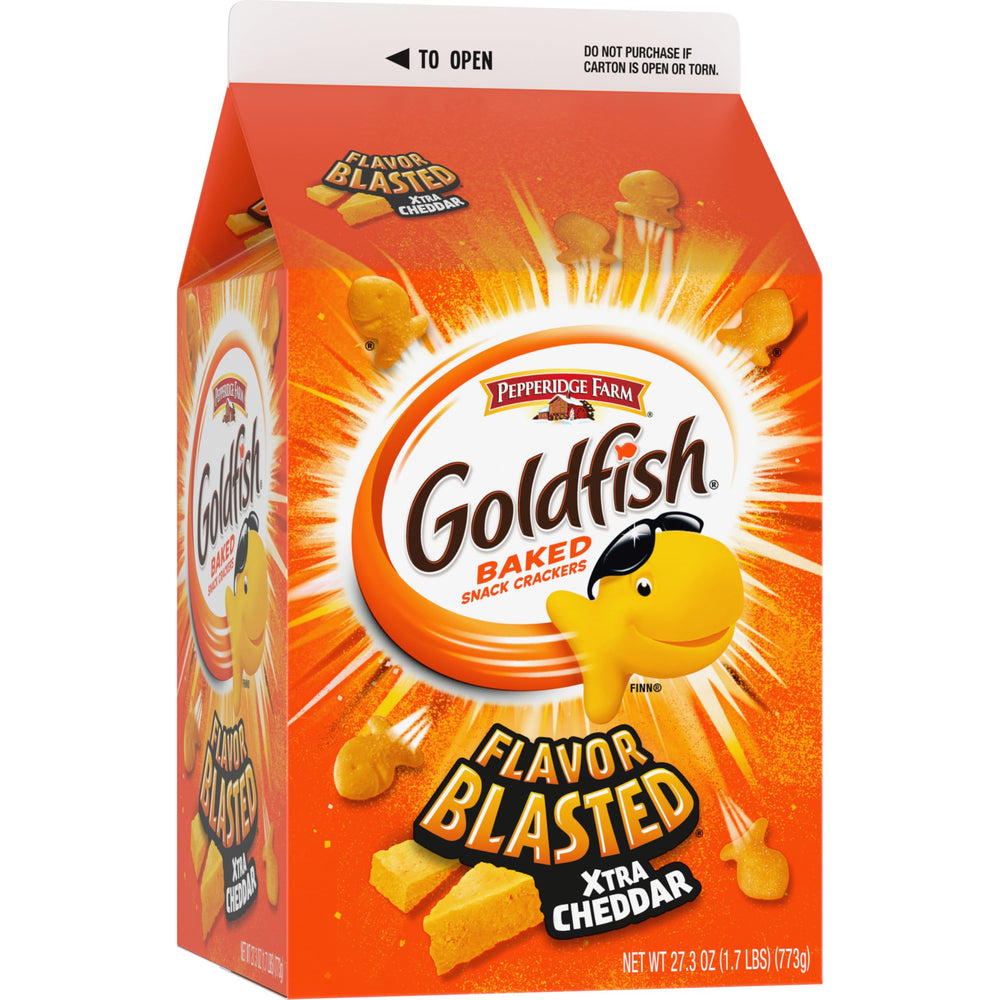 Open Goldfish carton beside a kid's lunch box and fruit for a balanced snack.