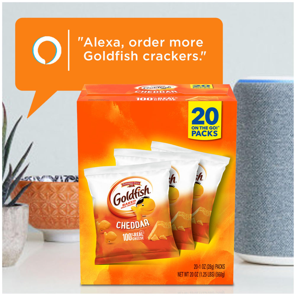 Goldfish crackers beside a sandwich for a complete lunch.