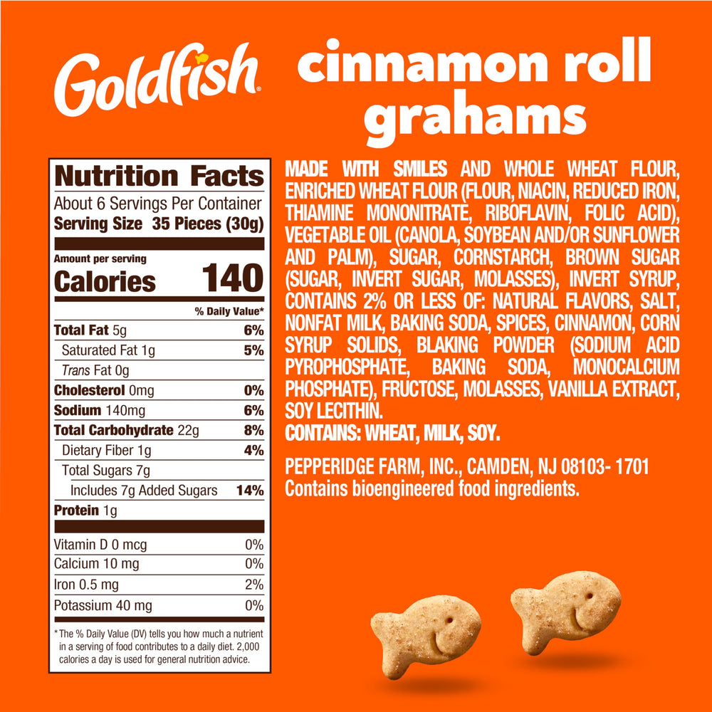 Goldfish Grahams Cinnamon Roll crackers close-up with crumbs, perfect for a playful crunch any time.