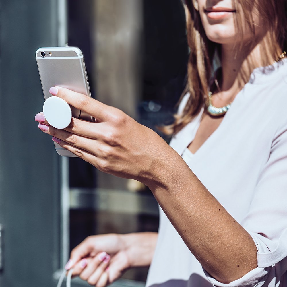 Goldfish PopGrip expanded stand used for handsfree video and FaceTime