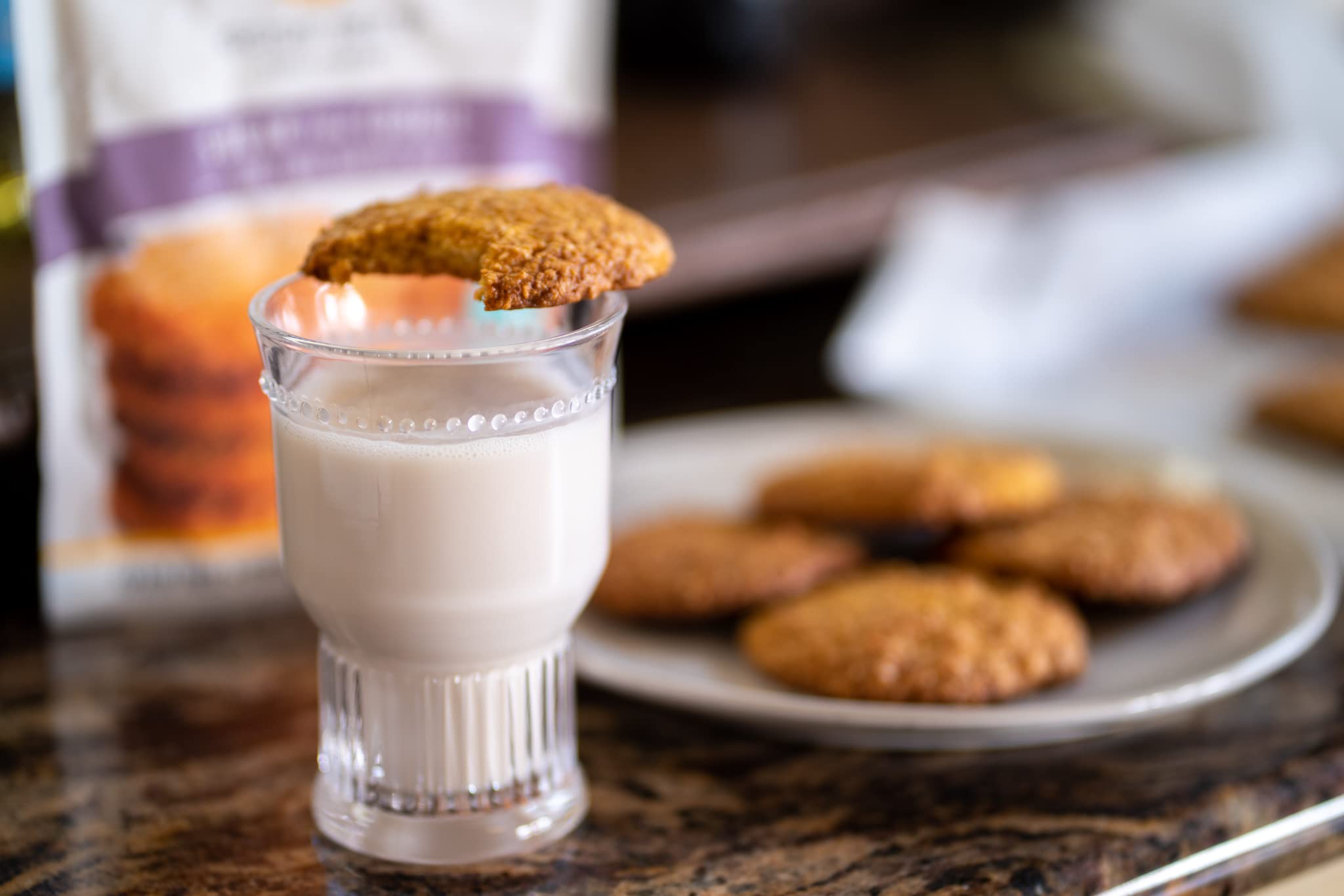 Cookies with toppings next to milk, showcasing serving inspiration.