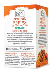 Good Earth Tea Co. Sweet & Spicy teabags brewing in a warm cup.