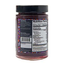 Good Good Blackberry Jam bottle on table conveys a ready-to-serve, low-calorie spread.